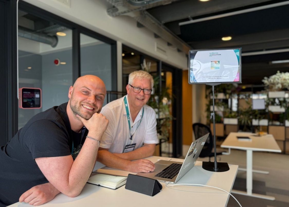 Tao Climate co-founders Felix Roick, left, and Gary Byrnes, right, working together at a laptop.